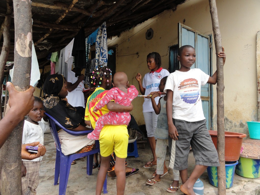 Guinea Red Cross volunteers travel door-to-door sharing information about Ebola. Each Red Cross team has members who can speak four languages. 