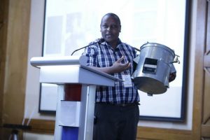 Kenyan innovator Kenneth Ndua showcases his energy-saving charcoal cooker that also purifies water, helping fight waterborne diseases. Photo Courtesy: African Academy of Sciences