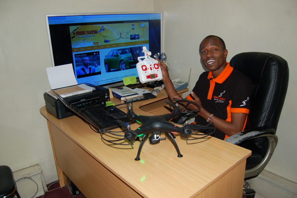 Young innovator Kelvin Macharia displays a multipurpose drone he is making. Photo by Fredrick Nzwili