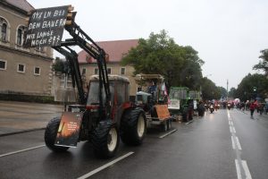Bavarian farmers and motorcyclists lead the large protest crowd through Munich City
