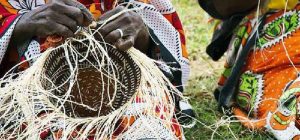 Women making Kiondo, a traditional Kenyan basket whose patent remains mystery.