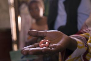 Tanzania, Mafinga, Mufindi region, Patient-centred treatment for Tuberculosis, improving patient's access to treatment, patients at theirs homes taking drugs, 18.10.2006 © 2006 Christian Flierl / pixsil.com