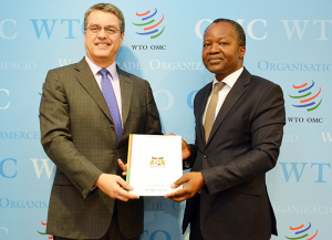 Ambassador Eloi Laourou presents Benin's instrument of acceptance of the 2005 protocol amending the WTO’s TRIPS Agreement to DG Azevêdo.
